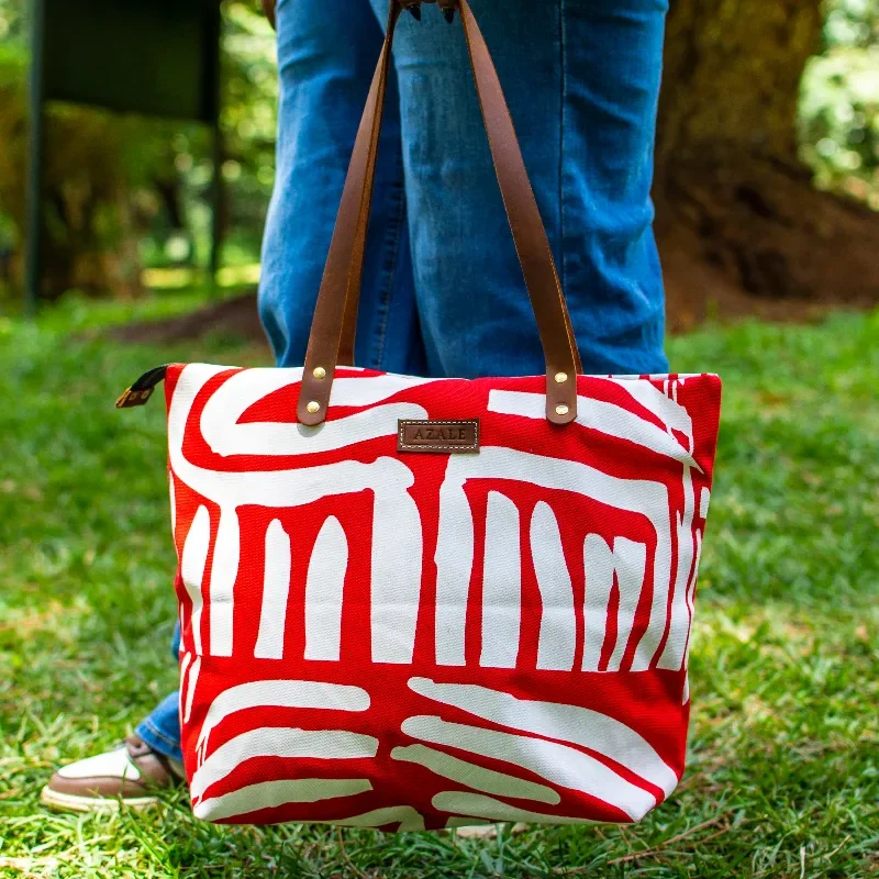 Red Alice tote with blue jeans