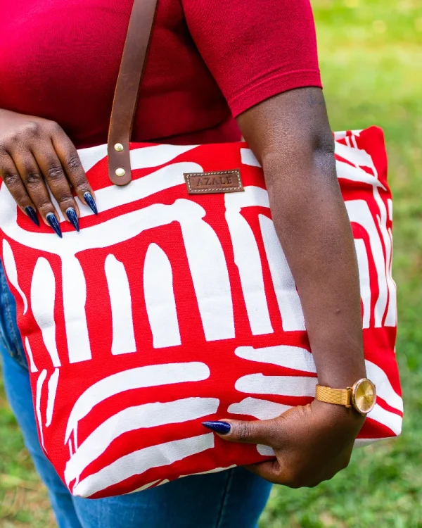 Red Azale Alice Tote Bag hanging from shoulder