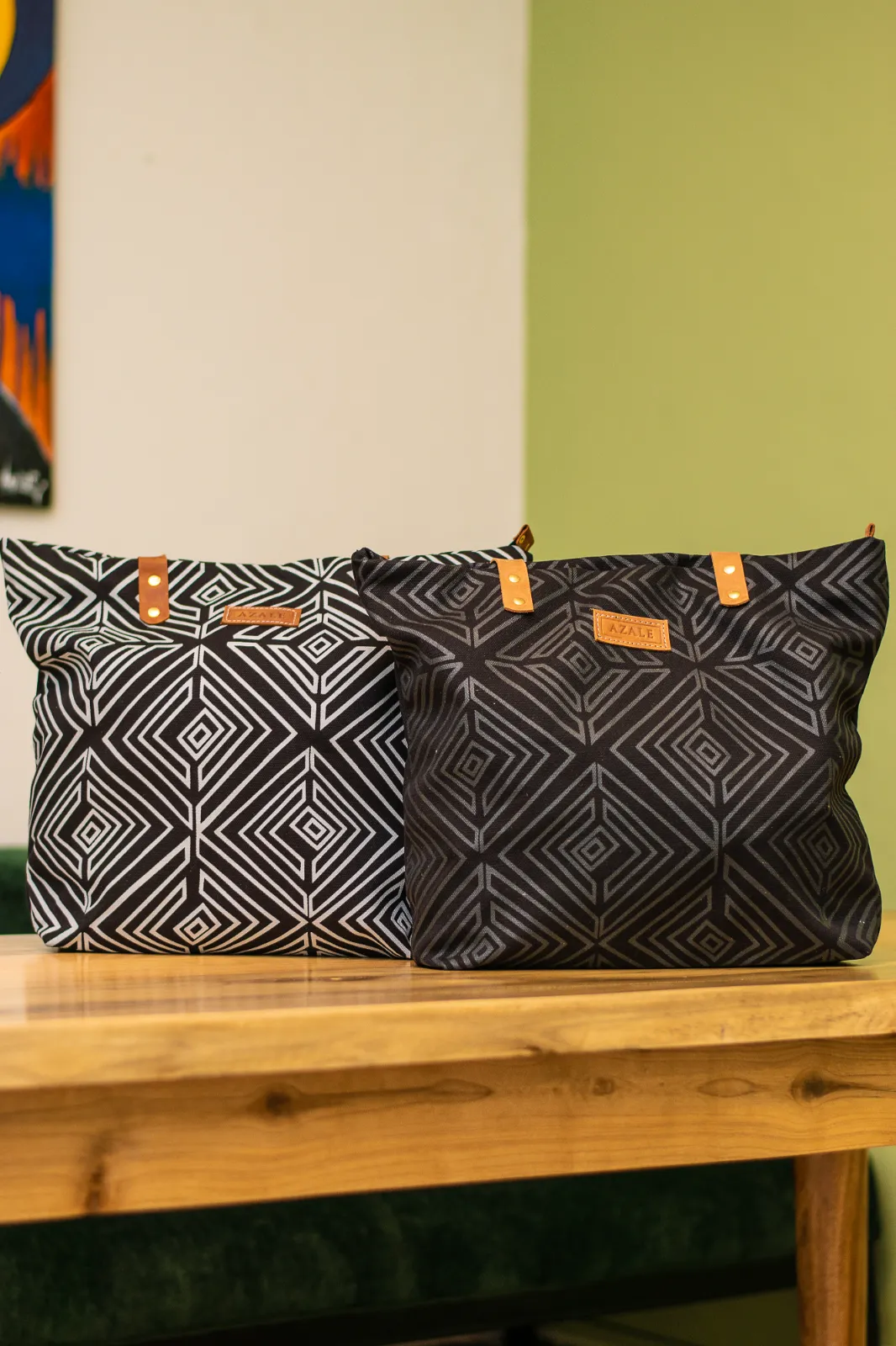 white on black & black on black nsukka tote bags